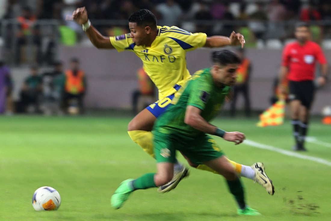 AL-Nassr's Brazilian midfielder Wesley runs with the ball (Photo by AHMAD AL-RUBAYE / AFP)