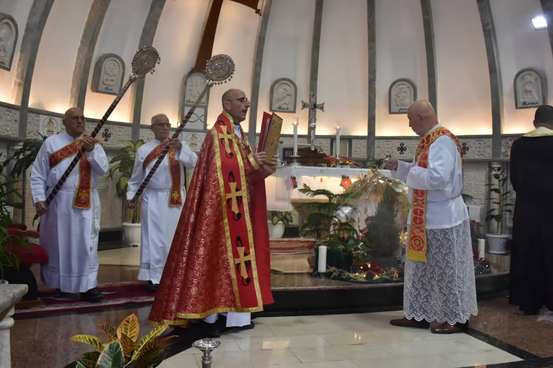 Photos: Somber Christmas Mass in Hamdaniya