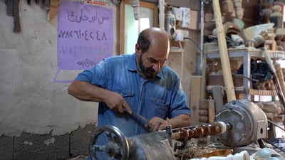 In Al-Alawi market, family keeps woodcraft tradition alive despite competition from imports