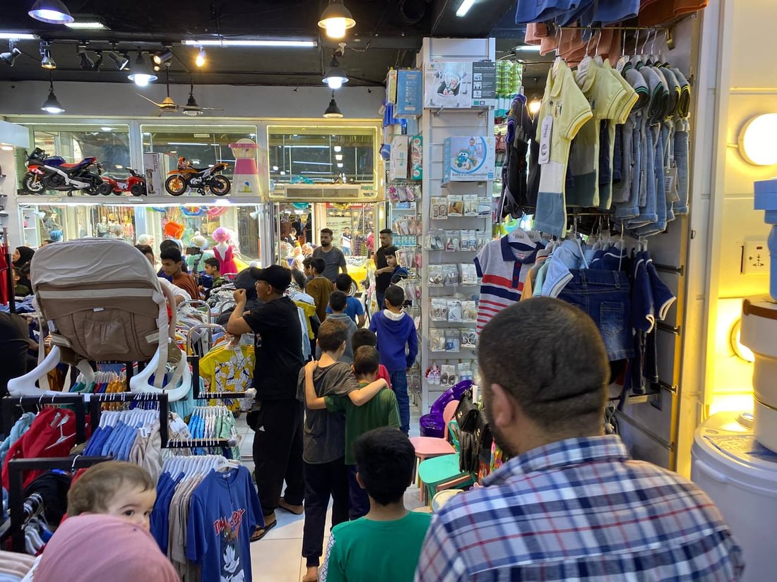 لە خانەقین جلوبەرگی جەژن بۆ منداڵانی بێ باوک دابینکرا