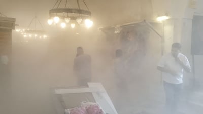 صور من كركوك.. حريق يلتهم محلاً للملابس في سوق القيصرية