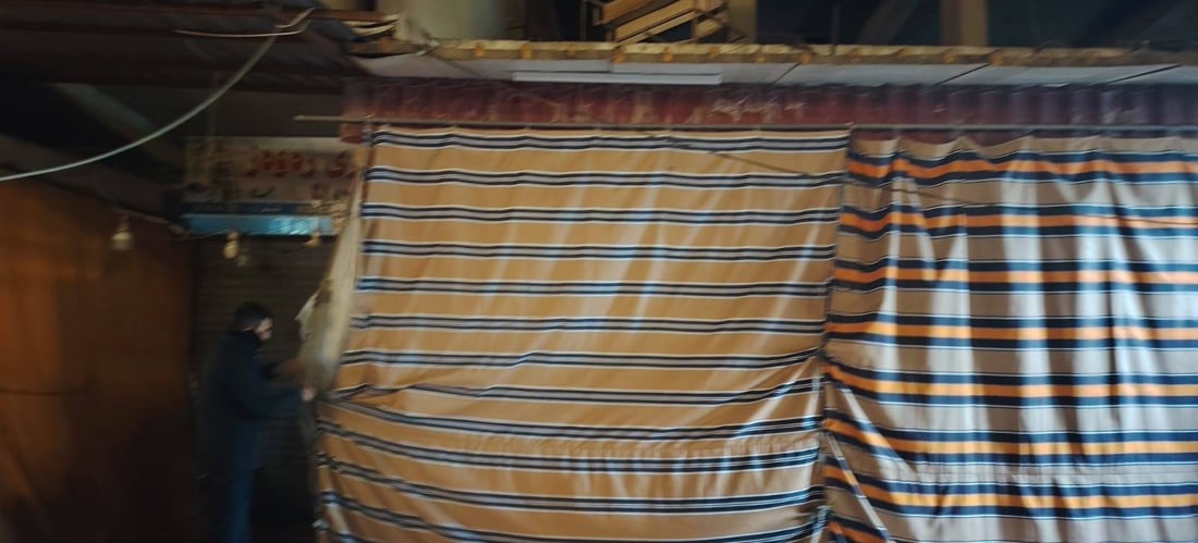 بۆ پاراستنیان لە ئاگر؛ شارەوانی هەولێر پەردەی بەردەم دوکانەکانی لادەبات