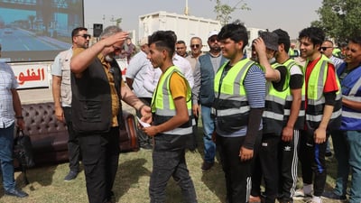 الفلوجة تحتفل بعمالها وتكرمهم 150 ألف دينار (صور)