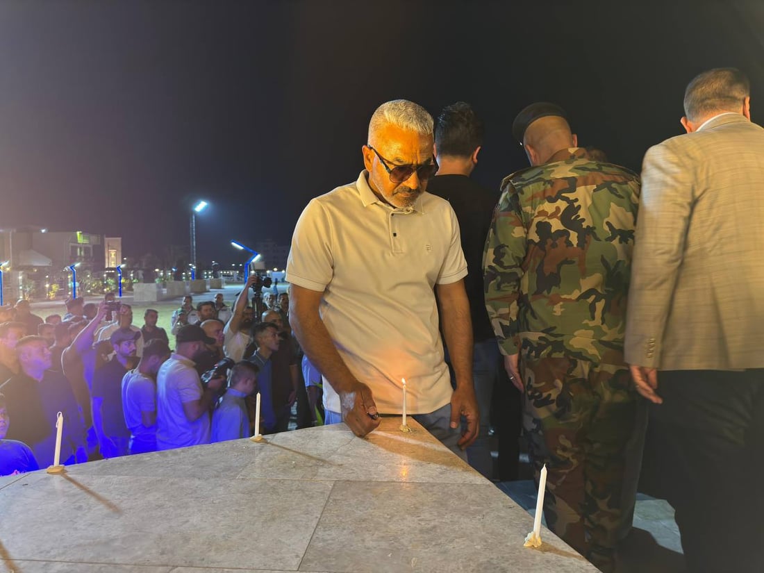 صور من الكوت: شموع وحزن حول نصب سبايكر في ذكرى المجزرة الأليمة