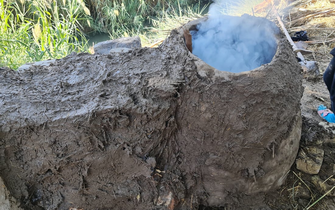 Diwaniyah women keep tradition alive with clay ovens for bread baking