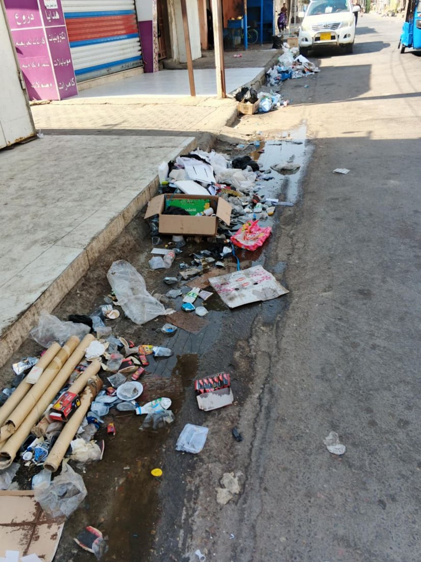 Garbage piles up in Al-Qala’a Al-Salih town as sanitation workers strike over unpaid wages