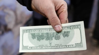 Central bank tells banks to stop applying different rates for old dollar bills