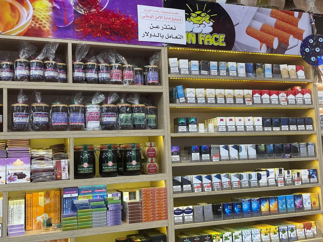 أسواق النجف تعتذر عن التعامل بالدولار والأمن الوطني يعاقب من يخالف (صور)