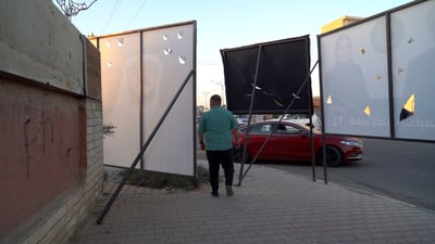 Tikrit sidewalks blocked by campaign posters ahead of election as municipality threatens fines