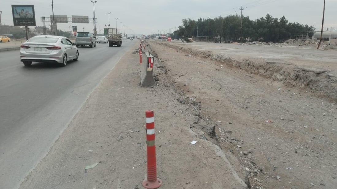العمل متوقف بتأهيل مدخل بغداد الجنوبي منذ 11 شهراً.. تعليق من الأمانة (صور)