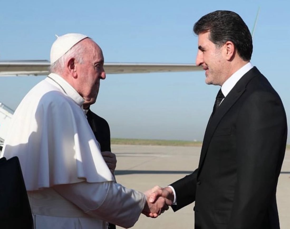 Pope Francis is welcomed by Kurdistan Region President Nechirvan Barzani upon his arrival in Erbil during his historic 2021 visit to Iraq