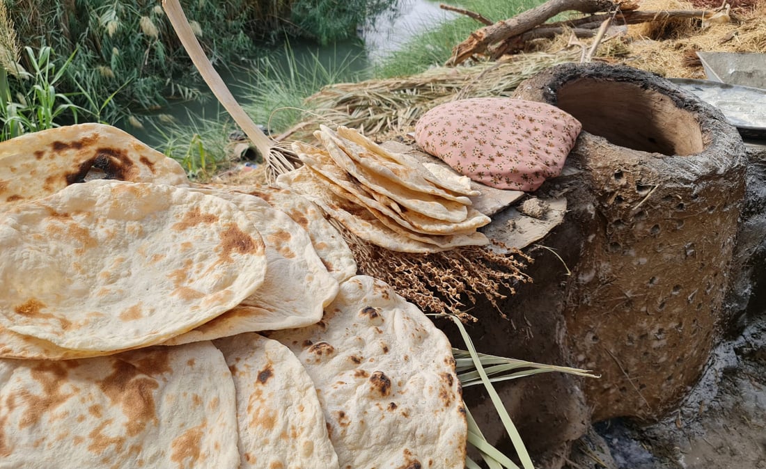 Diwaniyah women keep tradition alive with clay ovens for bread baking