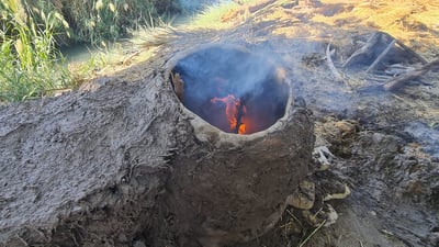 Diwaniyah women keep tradition alive with clay ovens for bread baking