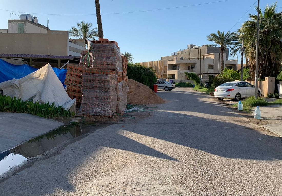 بغداد: مواد البناء تزعج سكان “الداخلية”.. والبلدية تتوعد بـ “الغرامة أو السجن”