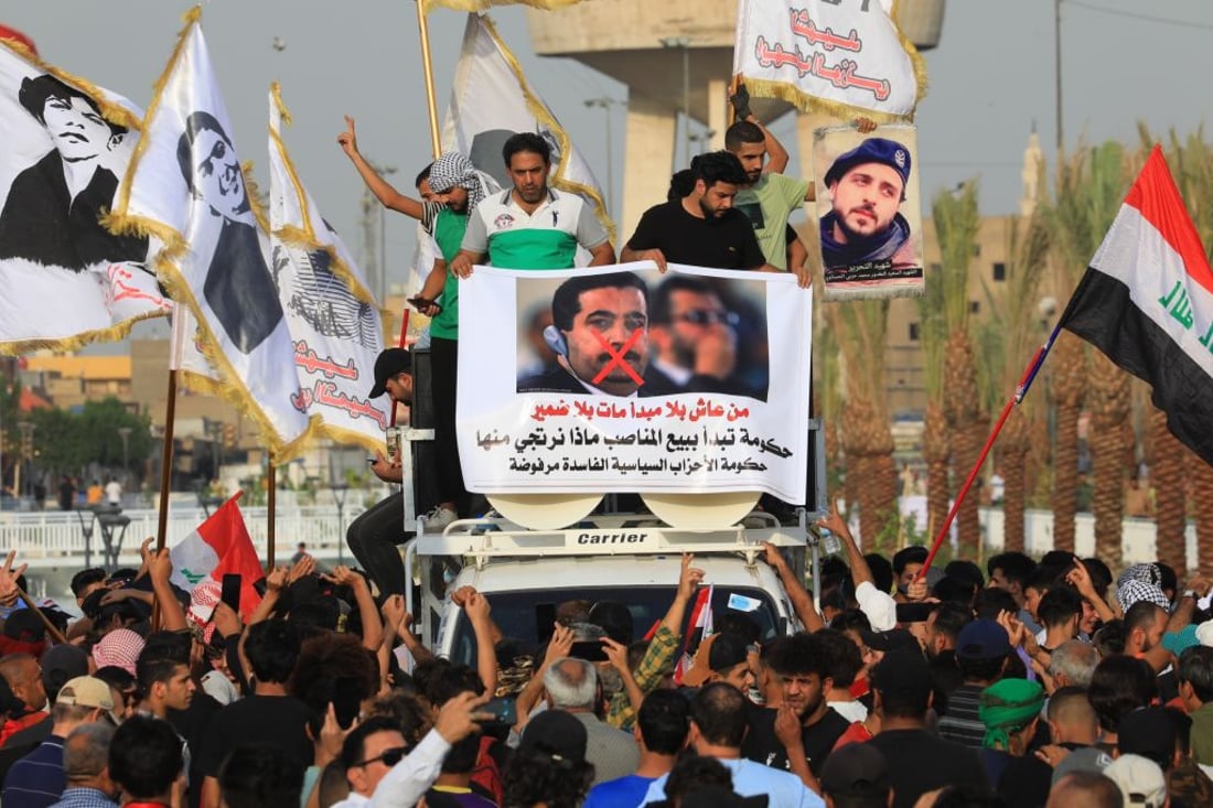 BAGHDAD, IRAQ - OCTOBER 25: People gather in Tahrir Square to stage a demonstration marking the third anniversary of the pro-reform protests on October 25, 2019, which erupted due to unemployment, corruption and lack of public service, leading to the resignation of the government at the time in Baghdad, Iraq on October 25, 2022. (Photo by Murtadha Al-Sudani/Anadolu Agency via Getty Images)