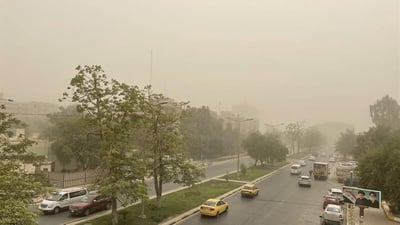 Dust and cooler air mass sweep western Iraq as temperatures dip slightly