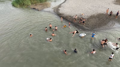 Euphrates riverbank in Rawa offers young residents a rare summer escape