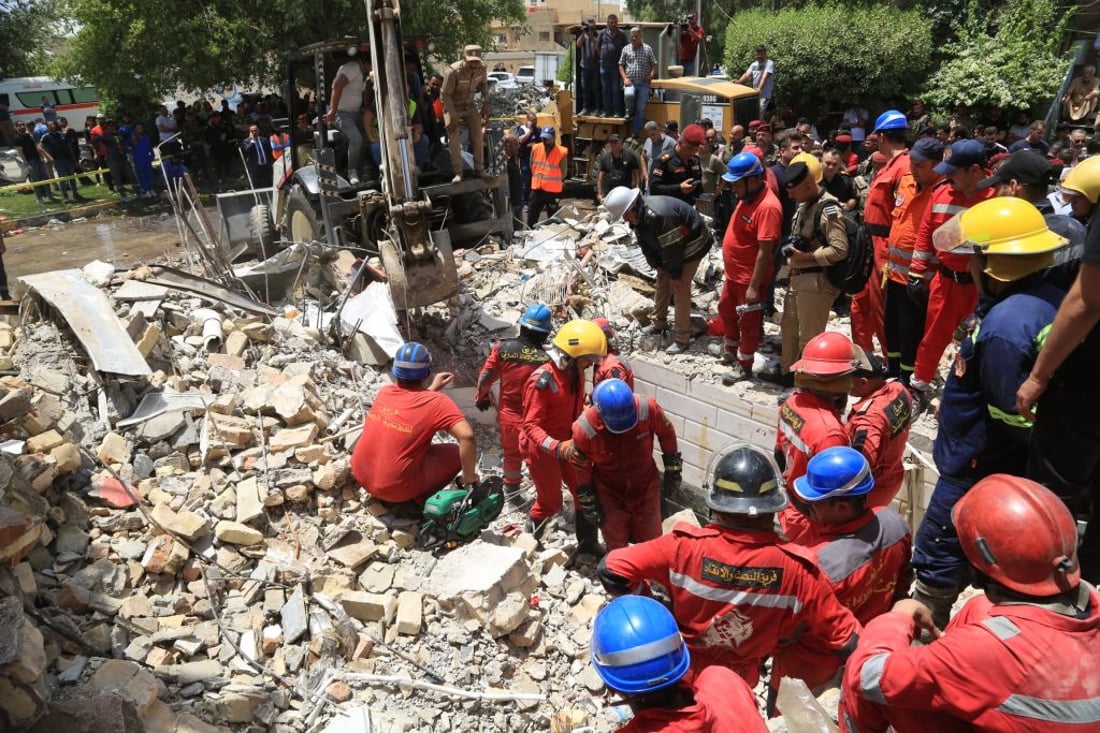 BAGHDAD, IRAQ - MAY 29: Search and rescue work continues after a powerful explosion apparently caused by a gas leak in a restaurant that blew away the two-story building in Baghdad, Iraq on May 29, 2022. (Photo by Murtadha Al-Sudani/Anadolu Agency via Getty Images)