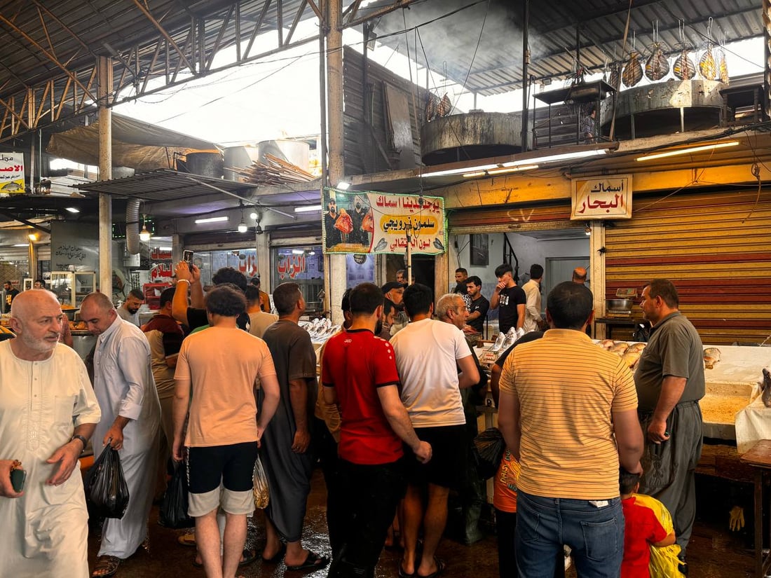 سوق السمك في الموصل ينتعش.. زوار أجانب يتوافدون يومياً (صور)