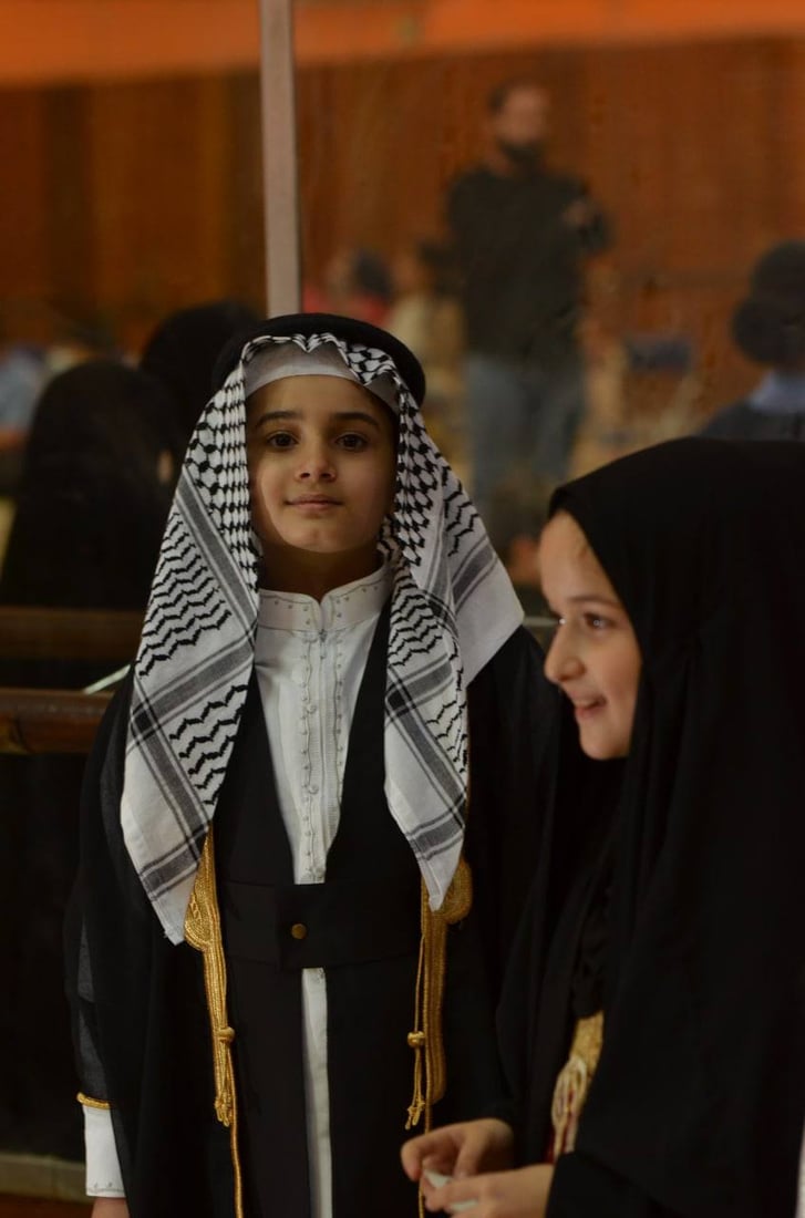 صور: أطفال بغداد في مدرسة الموسيقى بأزياء حضارات العراق ومدنه