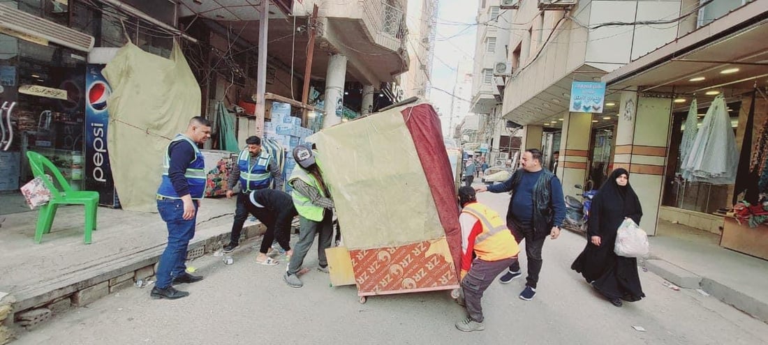 صور من النجف: الشفل الأصفر يقتلع البسطيات في شوارع الرسول والقديمة ومحيط الإمام
