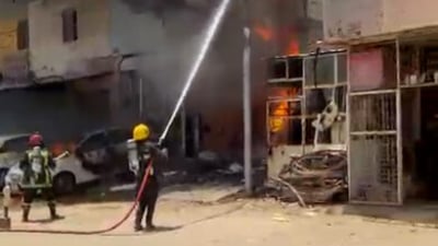 Firefighters contain large blaze at Najaf commercial building