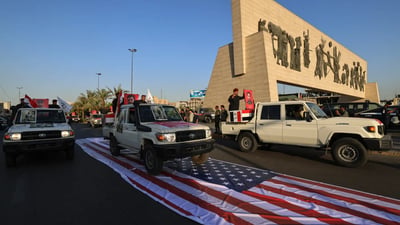 بە فەرمانى عەلى زەیدى؛ ئەوانەى بەسەر ئاڵاى ئەمەریکادا رۆیشتن دەستگیرکران