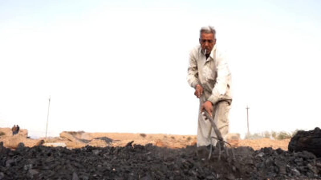 Wasit craftsman uses traditional pit method to produce charcoal