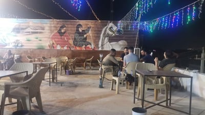 Restaurant owner opens terrace to beat the heat and power outages