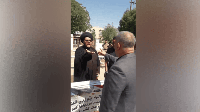 فيديو: رجل دين معمم يشتبك مع قائمقام عفج ويرفض مصافحته