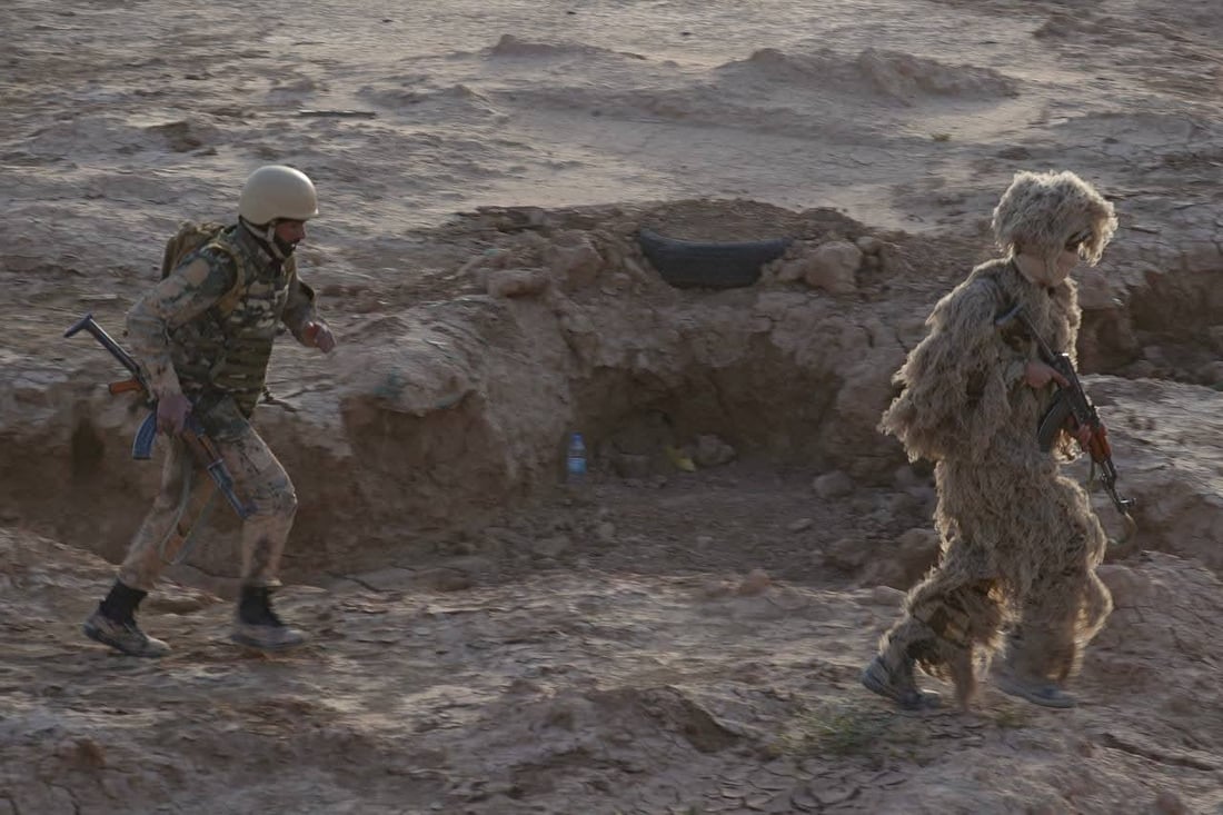 صور: قوات خاصة من الحشد الشعبي تجري تمريناً بالذخيرة الحية