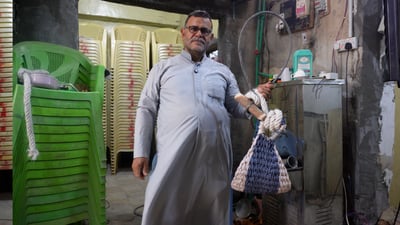 Basra man preserves traditional tool for climbing date palms