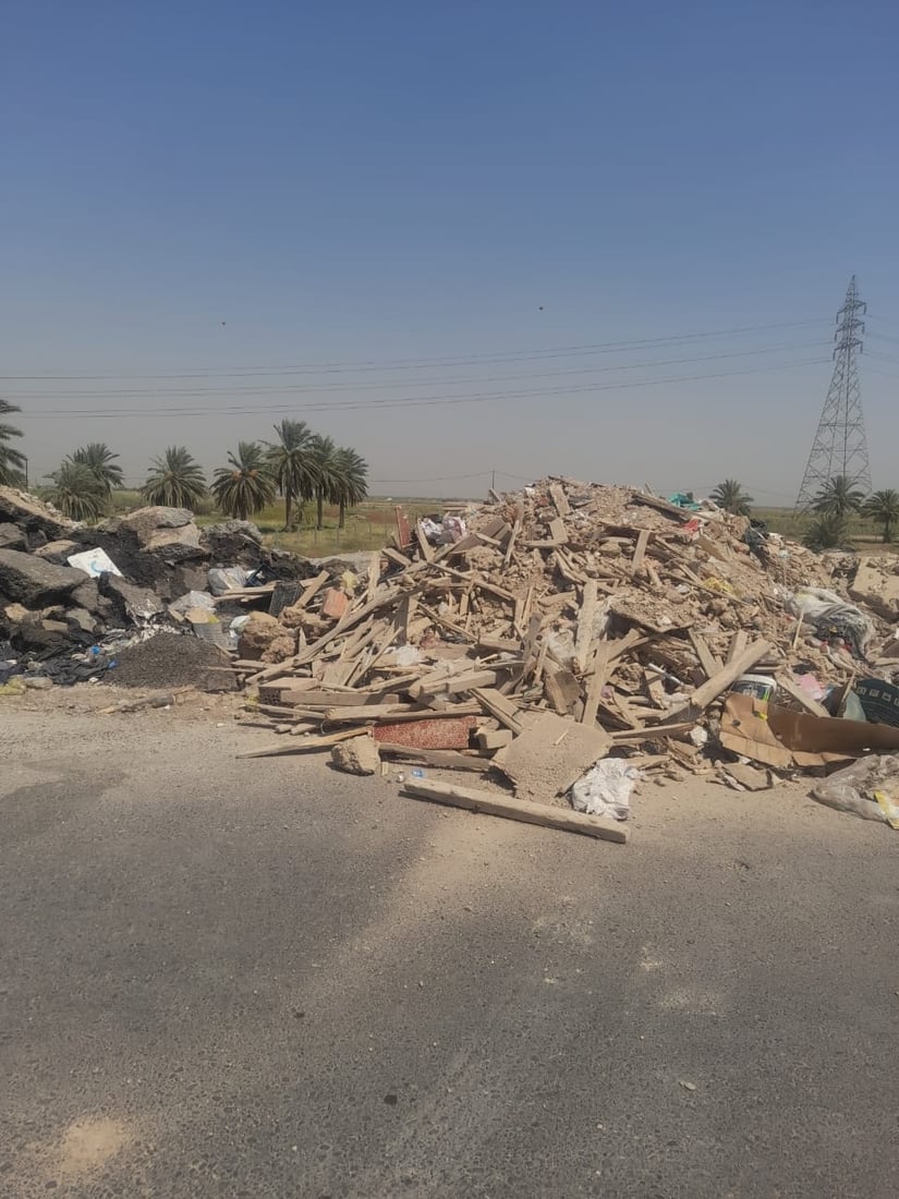 Police detain two for illegal dumping on Baghdad road