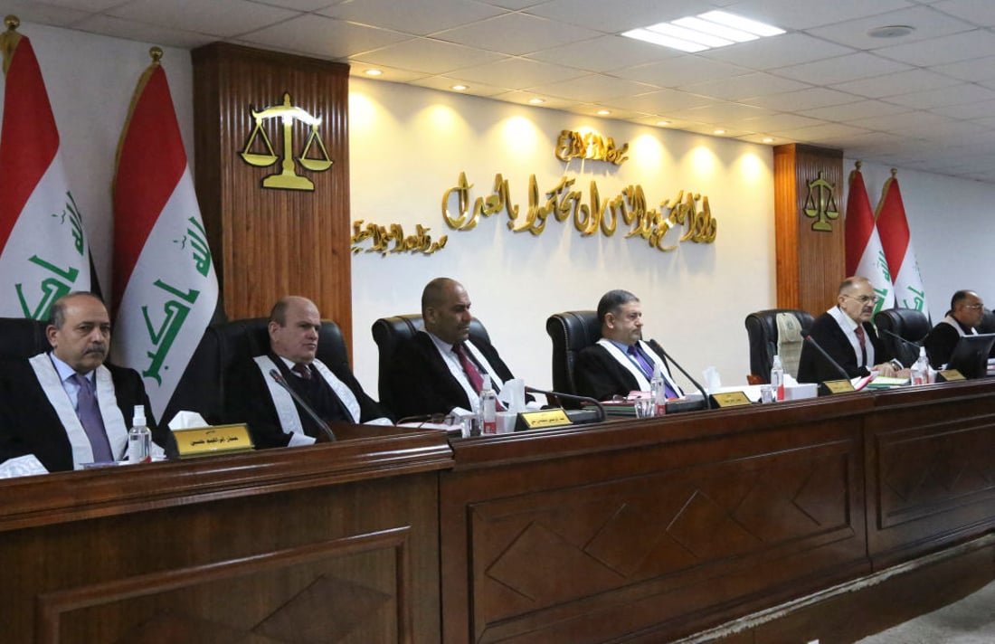 Iraqi judges attend a court session at the Supreme Judicial Council in the Iraqi capital Baghdad on January 19, 2022. - Iraq's top court on January 13 provisionally suspended the newly-appointed speaker of parliament, while judges consider an appeal by two fellow deputies claiming his re-election by other lawmakers was unconstitutional. The Federal Supreme Court decided 