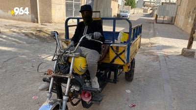 Mobile bread seller in Basra is a daily livelihood with stale bread